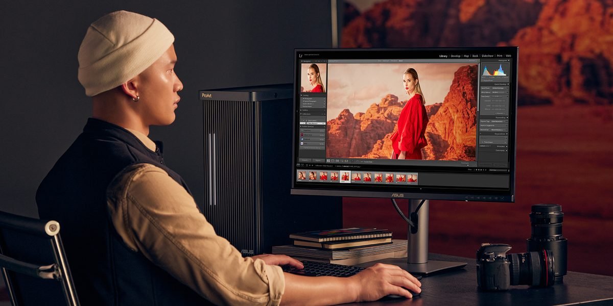 Photographer editing photos on a ProArt display